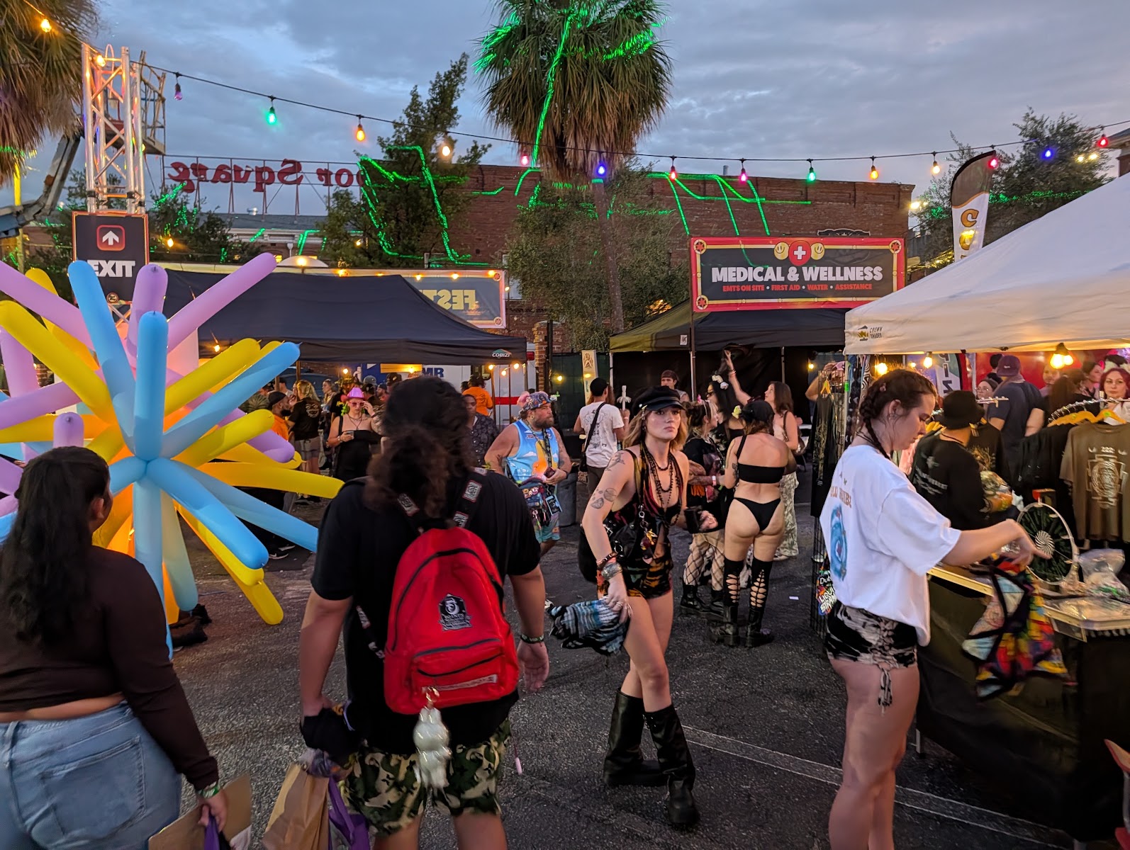 Colorful sunburst installation and vendor tents at 710 Dab Day